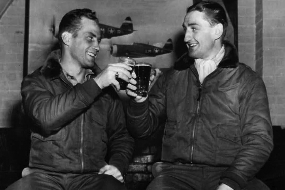 Gabreski (right) and Major Robert Johnson share a toast as the leading American aces in the European theater after Gabreski tied Johnson's 27-victory score. (National Archives)