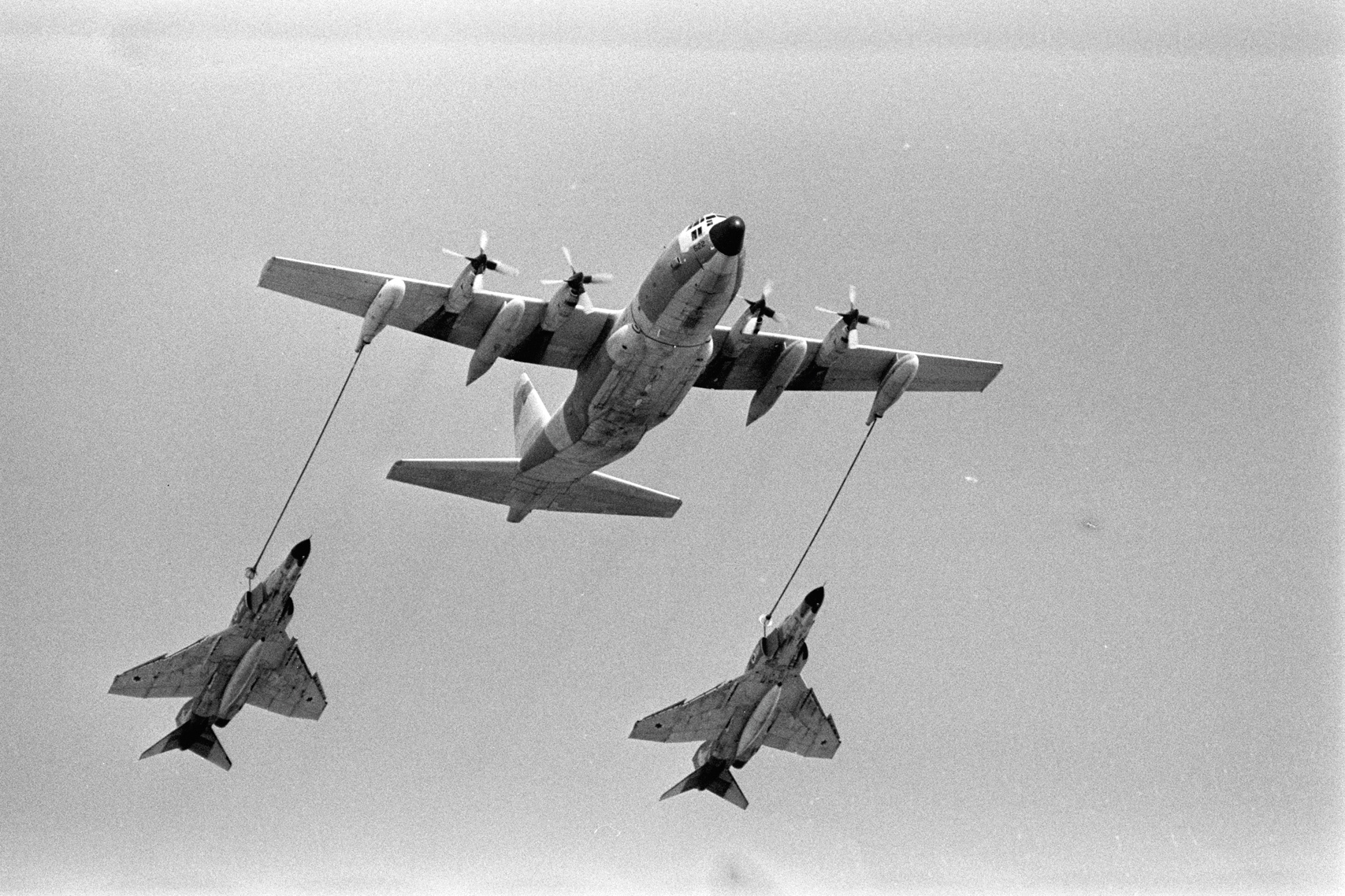 An IAF C-130 refuels two McDonnell F-4E Phantom II fighters. (Israeli Air Force)