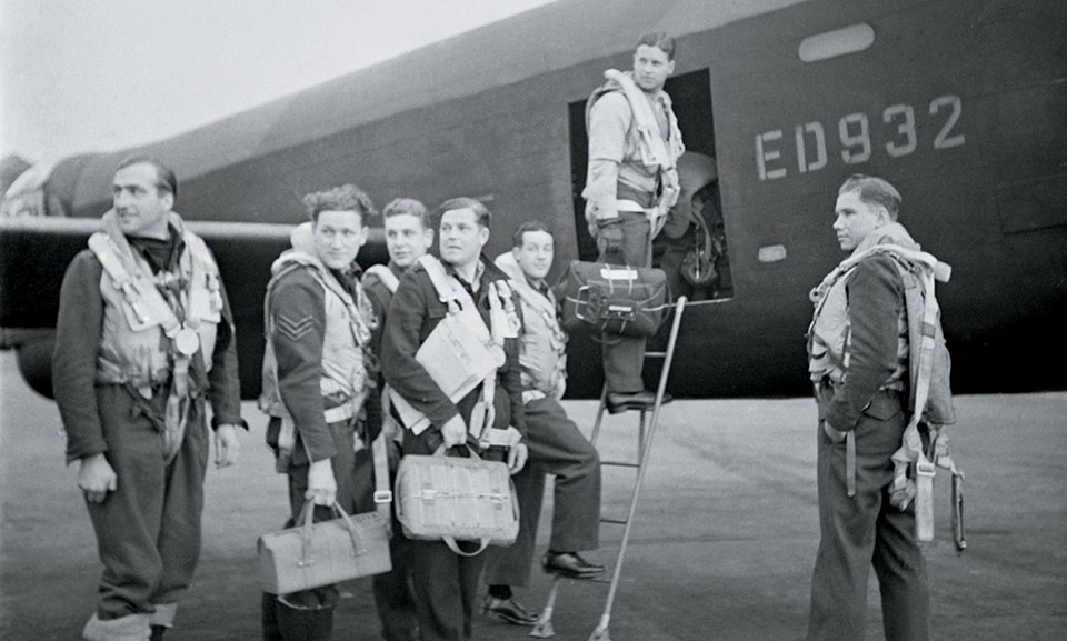 Gibson (at door) and his crew board their Lancaster before the raid. (IWM CH 18005)