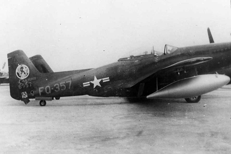 The damage to the tail of Lt. Charlie Moran's F-82 Twin Mustang is visible in this photo. The attacking Yak-11 fighter never had the chance to finish the job as it was shot off Moran's tail by squadron mate Lt. William “Skeeter” Hudson. (U.S. Air Force)