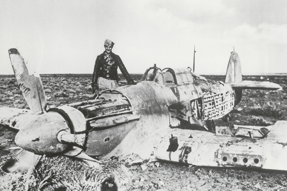 Lieutenant Marseille poses with a Hawker Hurricane of No. 213 Squadron he shot down. (Bundesarchiv Bild 101I-440-1313-03 Opitz)