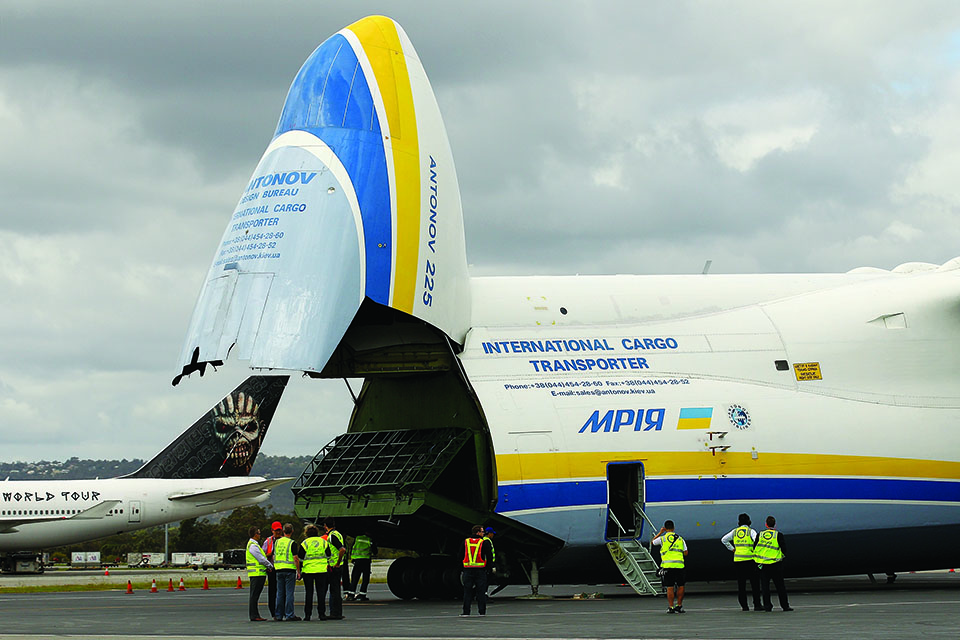 The mammoth transport raises its front end to unload cargo in Perth, Australia. (Paul Kane/Getty Images)