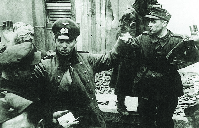 By February 14, 1945, the battle was over; German soldiers surrender. Yet for Budapest, the situation grew still more dire, as Soviet troops brutalized the city and its population. (Institute and Museum of Military History, Buda Castle)