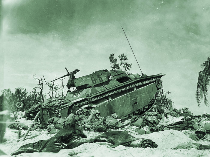Marines on Peleliu use an Amtrac for cover, September 15, 1944. (National Archives)