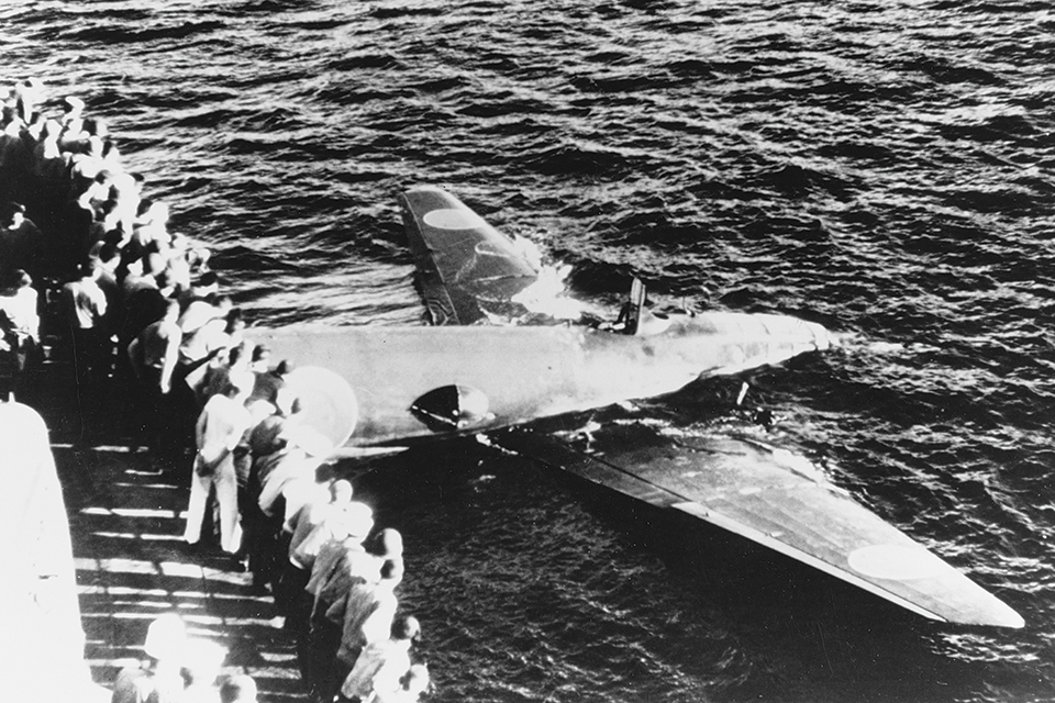 Crewmen on the destroyer USS Ellet observe the wreckage of a Betty that crashed during an attack off Guadalcanal on August 8, 1942. Of 23 Bettys that set out from Rabaul that day, only five returned. (U.S. Navy)