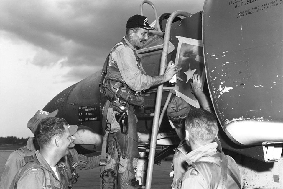 Operation Bolo accounted for seven MiG-21s shot down, Olds himself bagged one. By the end of the war he would add another three MiGs to his credit. In this photo he paints a second star on his Phantom after a successful battle on May 4, 1967. (U.S. Air Force)