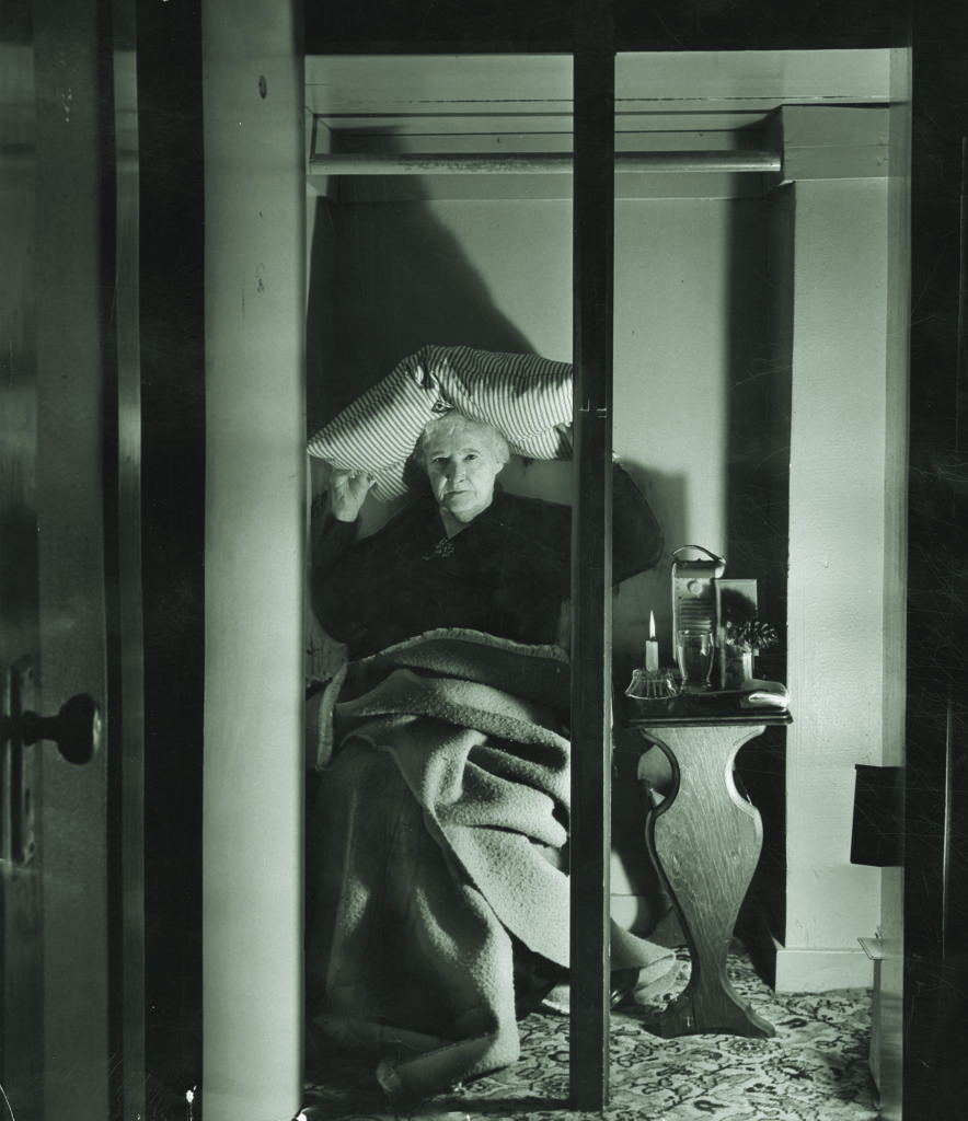 The threat of further Japanese attacks had Los Angeles on alert. One citizen set up  a makeshift air raid shelter in her home (above), while antiaircraft units (below) and civil defense corps (bottom) stood ready. L.A. HERALD EXAMINER COLLECTION/L.A. PUBLIC LIBRARY/HEARST COMMUNICATIONS, INC.