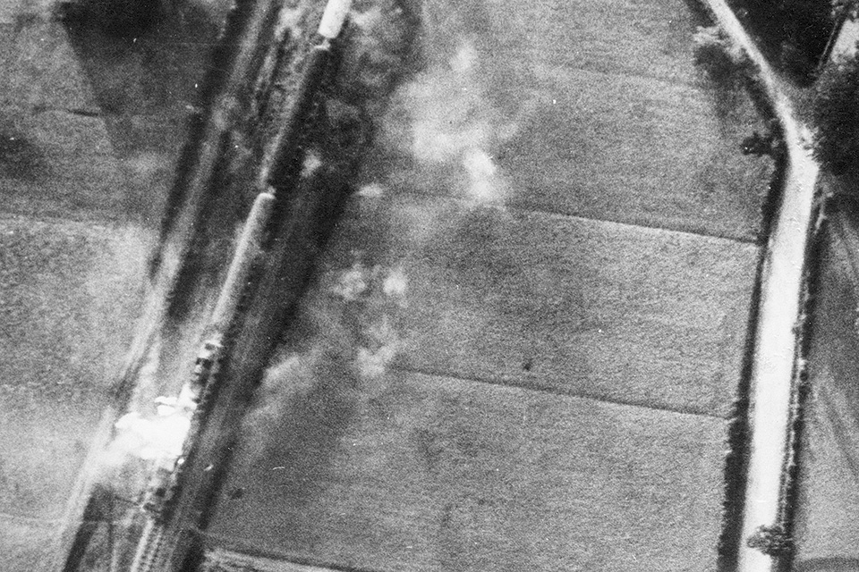 A German train smokes after being attacked by VOF-1 pilot Ensign John Mooney west of Carcassonne. (National Archives)