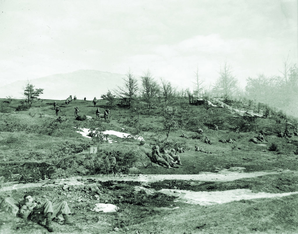 An 85th Regiment company moves out on Mount Belvedere as others wait in reserve. Below: engineers on Belvedere prepare to blow German mines with strings of TNT. (The Denver Public Library, TMD-374)