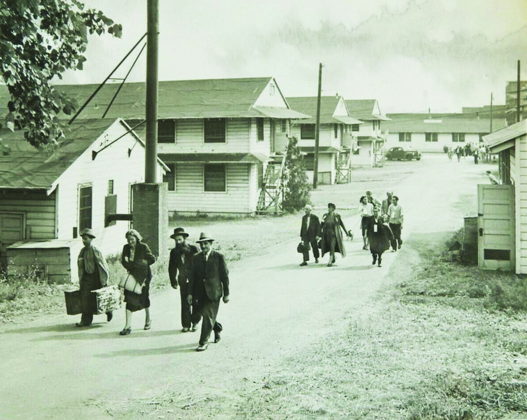 Displaced Europeans arrive in August 1944 at Fort Ontario, America’s only wartime refugee shelter. (ACME/Getty Images) 