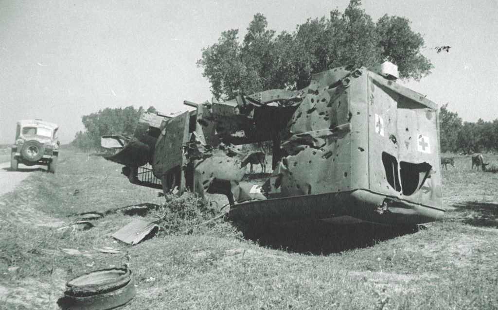 A destroyed AFS ambulance in Tunisia attests to the danger of the volunteers’ work. (Courtesy of the Archives of the American Field Service and AFS Intercultural Programs (AFS Archives))