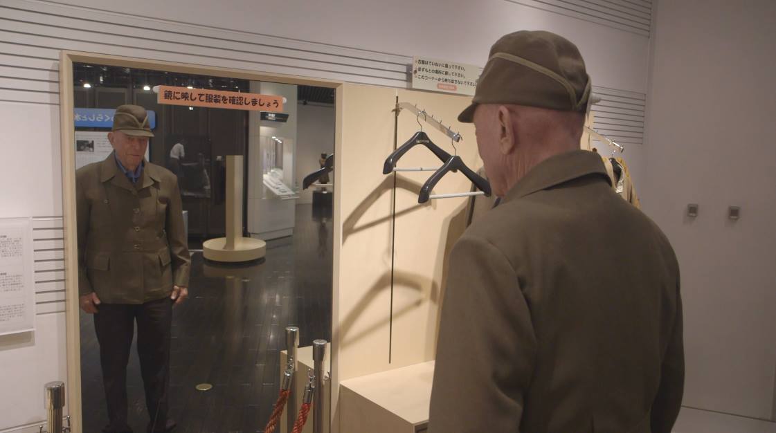 Yellin trying on a Japanese uniform, while visiting Japan in 2016. It fit him perfectly. (Courtesy "Jerry's Last Mission"/Facebook)
