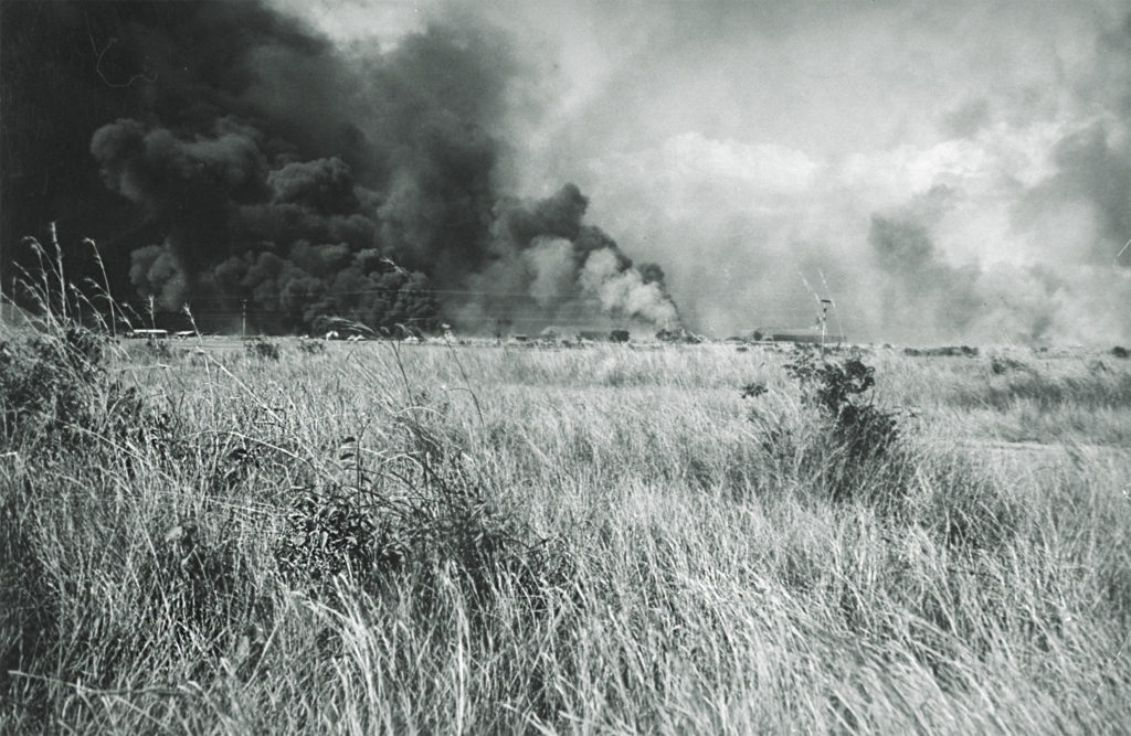 Smoke rises from Clark Field during the December 8, 1941, Japanese raid on the air base. Nearly half of the B-17s in the Philippines were badly damaged or destroyed. (The LIFE Picture Collection via Getty Images)