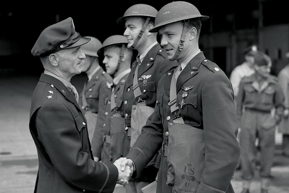 On July 11, Maj. Gen. Carl A. Spaatz (left) decorates newly promoted Major Kegelman (right) and crew: (from left) Cunningham, Tech Sgt. Robert Golay and 2nd Lt. Randall Dorton Jr.. (Keystone/Hulton Archive/Getty Images)