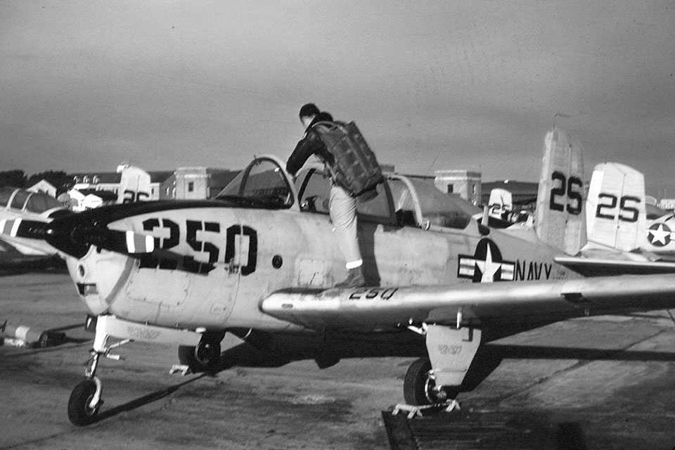 A student pilot climbs into a T-34B at Saufley Field for a training flight. (Scott McIntosch)