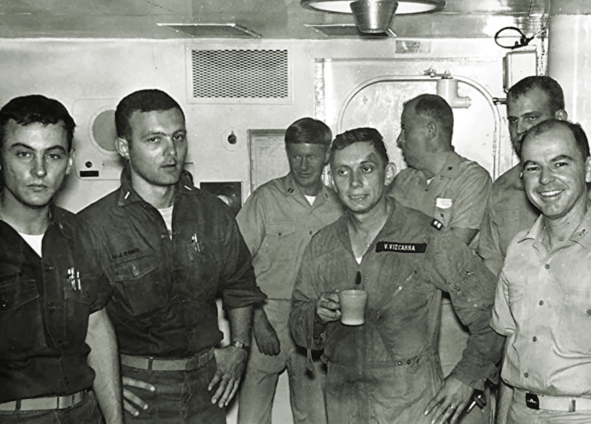 Vizcarra, center right, relaxes with the Halsey crew after his terrifying ordeal. / Courtesy Vic Vizcarra