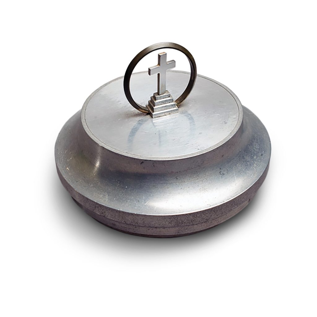 BREAKING BREAD: Trench art was frequently made from aluminum cut from downed aircraft. Staff Sergeant Leon Peacock made this ciborium, or container for communion wafers, in Burma in 1943, using aluminum sliced off the hub of a Japanese plane’s propeller.