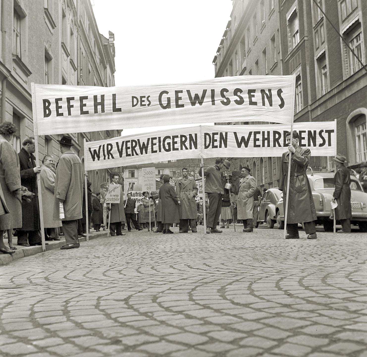 Despite NATO reassurances to oversee the Bundeswehr, antiwar activists (above right) preached caution in 1956. / Getty Images