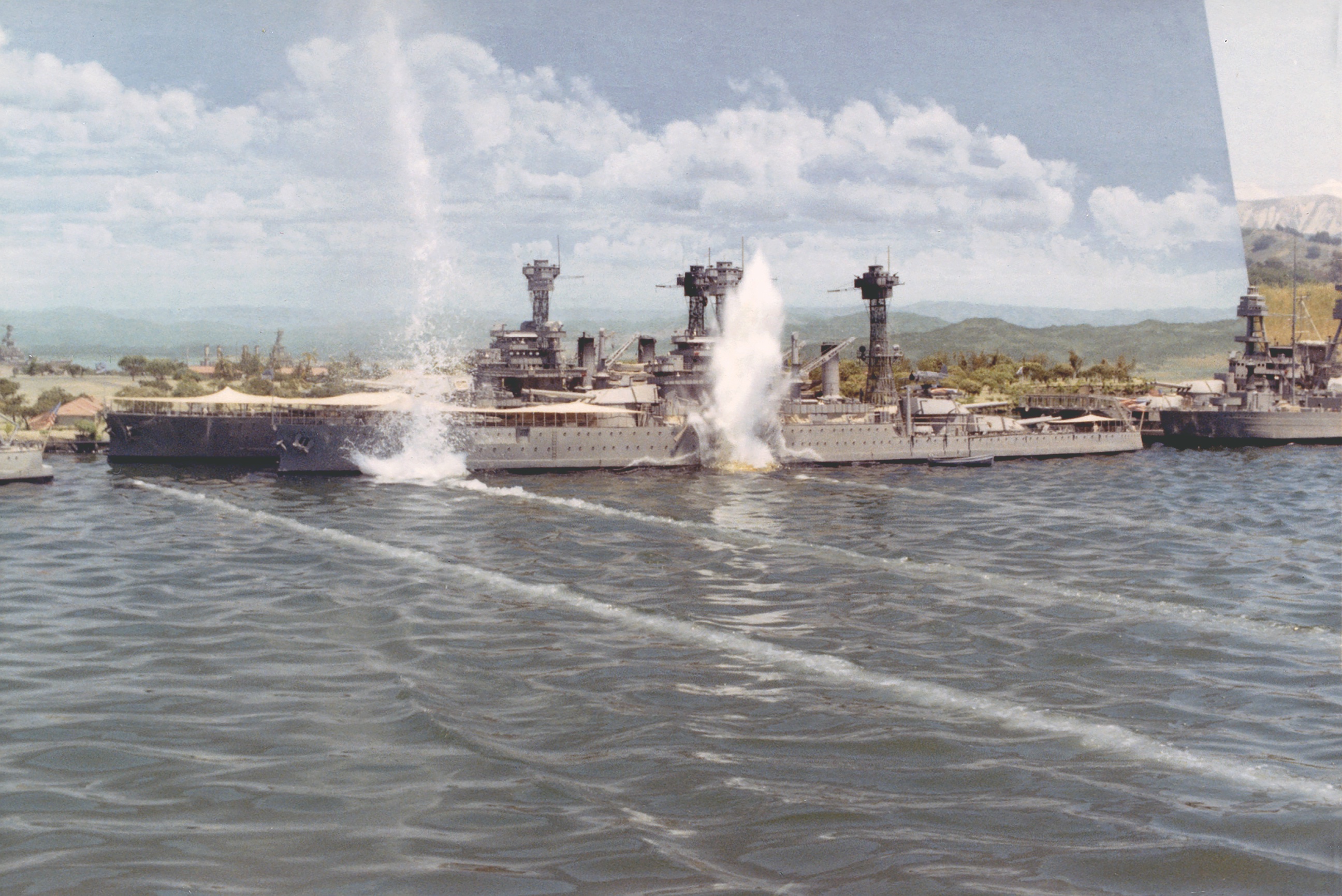 Torpedoes were simulated by a cable that pulled a compressed air nozzle and hose along under the water, leaving a trail of bubbles; small underwater charges created the water spouts that suggested detonations. (University of New Mexico)