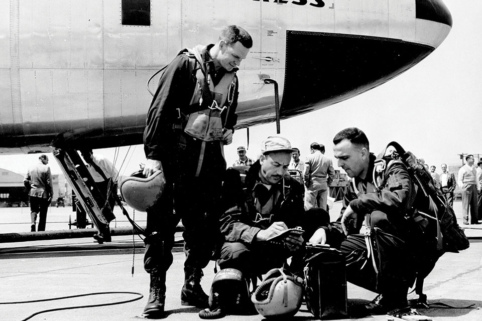 From left: Magruder, Alvin M. "Tex" Johnston and Lt. Col. Guy M. Townsend confer near the YB-52, which made its first flight on April 15, 1952. (U.S. Air Force/Getty Images)