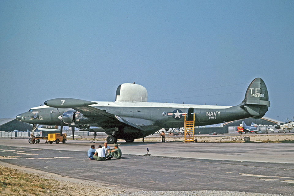 Rainproof 7 is prepped for its next mission: a "barrier run" on station 50 miles southeast of Hanoi. Note the F-4 Phantom "farm area" in the background. (Courtesy of Michael A. Roy via Hank Caruso)