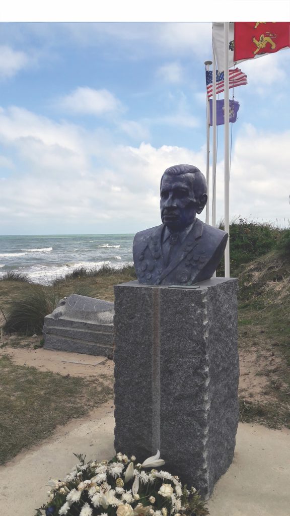 Funded by a group of Normandy residents, a bronze bust honoring Shay was installed on a bluff overlooking Omaha Beach on July 4, 2020. (Gavin Mortimer) 