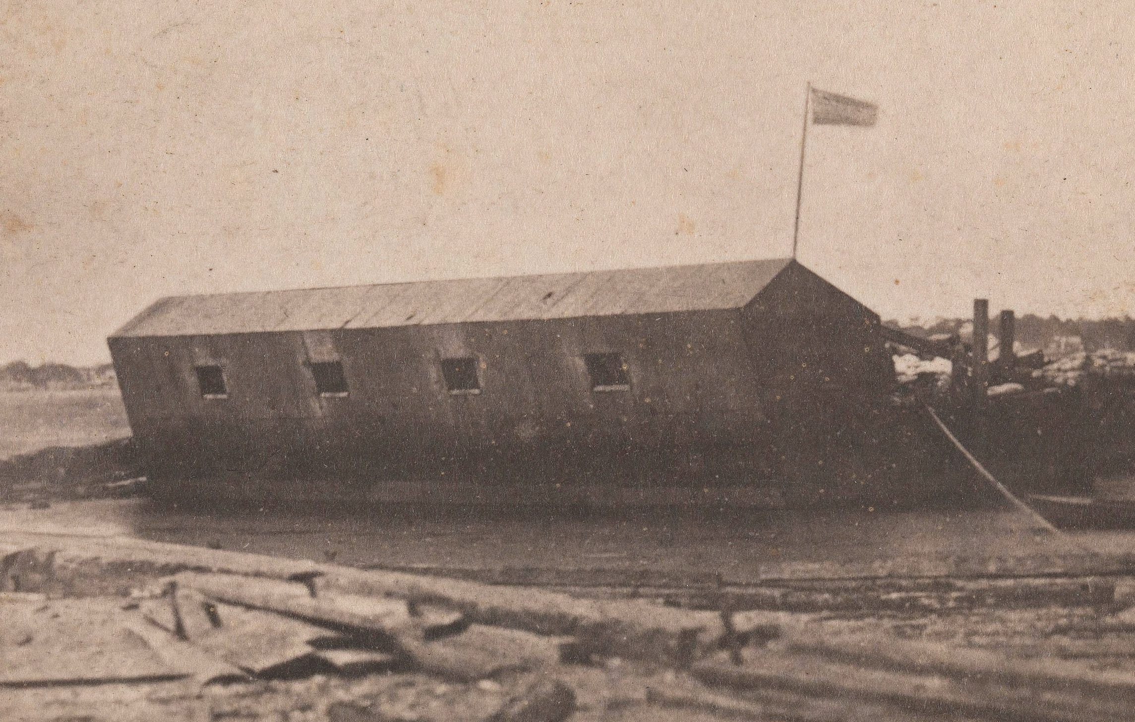The Floating Battery was moored near Fort Moultrie on Sullivan’s Island, as shown in this photo taken the evening before the Confederates opened fire on Sumter. (Heritage Image Partnership/Alamy Stock Photo)