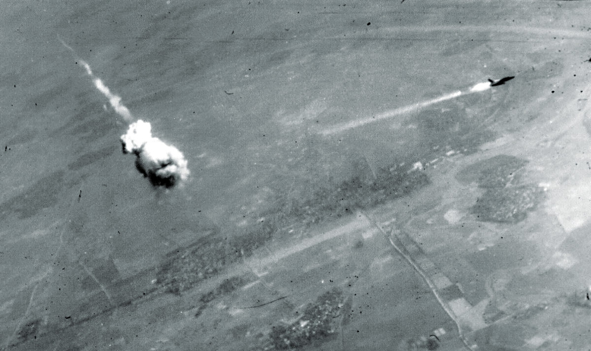 SA-2 surface to air missile F-105 trailing smoke just after interception by an SA-2. The SA-2 did not actually hit an aircraft—the fuse automatically went off when it neared the target, throwing deadly fragments over a wide area. (U.S. Air Force photo)