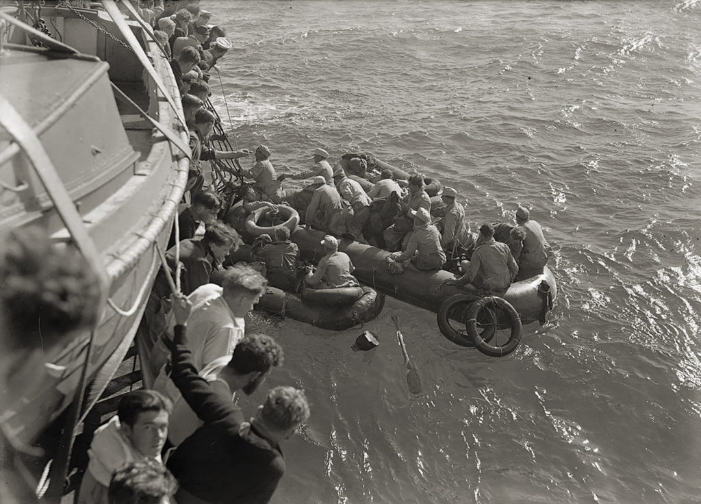 Captured German troops board a Royal Navy warship