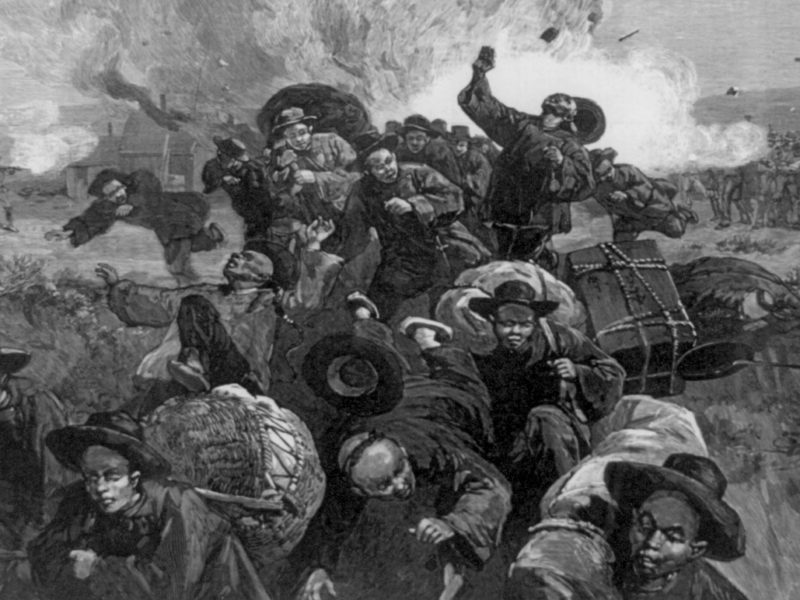 A drawing from photographs depicts the Rock Springs massacre of the Chinese in 1885