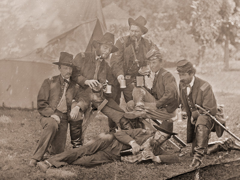 Group of Union officers drinking liquor in camp