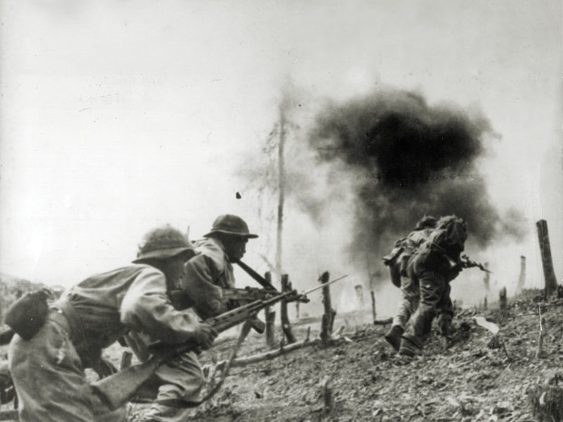 Photo of North Vietnamese troops during an assault on a South Vietnamese paratroop base at Laos during the Vietnam War.