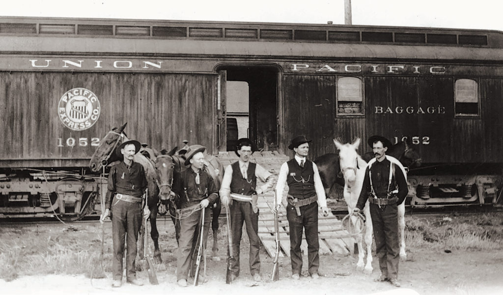 Possemen unload their horses from train