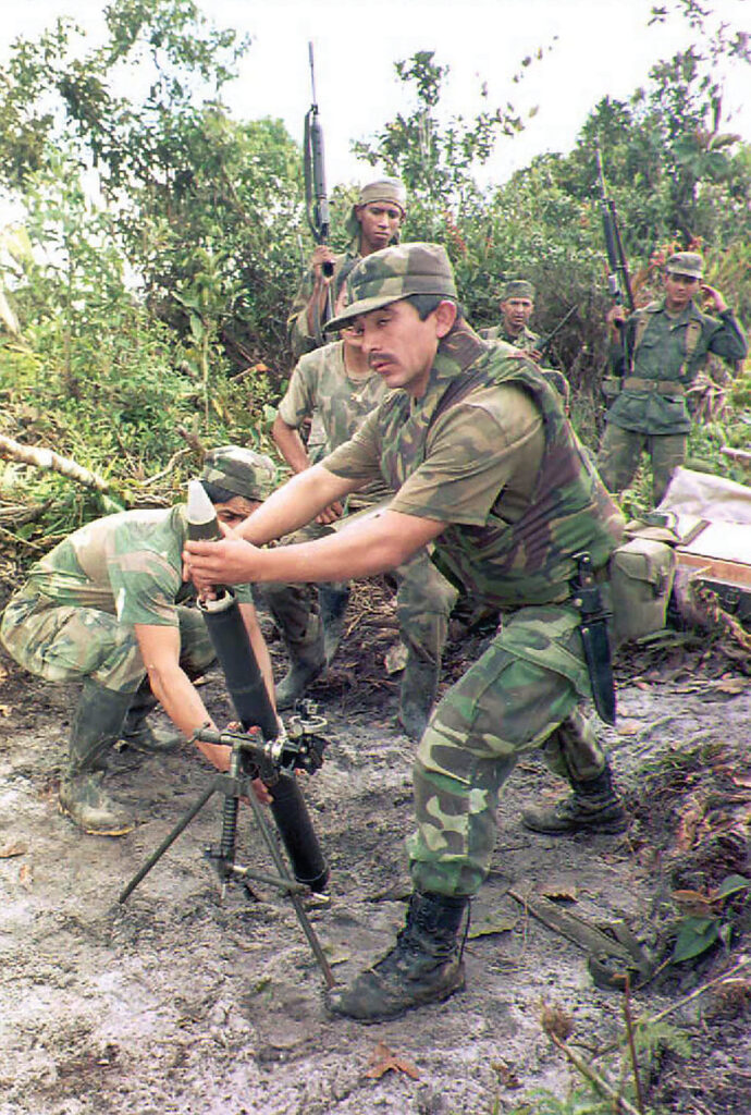 Photo of Ecuadoran soldiers preparing to fire mortars 13 February toward Peruvian troops in the conflict zone on the Ecuador/Peru border near Gualaquiza, Ecuador. Ecuadoran officials report some 50 deaths since the conflict began 26 January.