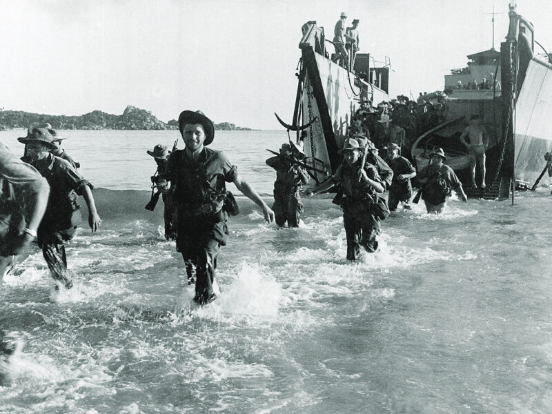 Photo of Marine commando forces of the French Expeditionary Corps wading ashore from a landing craft, in the Annam region in central Vietnam, as war operations against the Communist Viet Minh continue, on July 27, 1950.