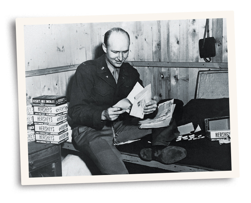 Photo of Gail Halvorsen opening mail for the ‘Candy Bomber’.