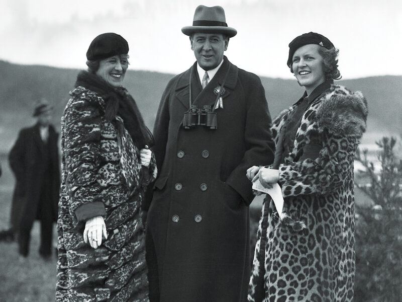 Photo of American financier and president of the New York Stock Exchange Richard Whitney poses with his wife Gertrude (nee Sheldon Sands) and his daughter Nancy at an unidentified event, 1934.
