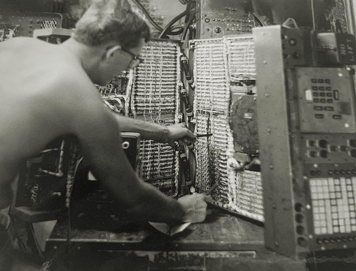 Photo of, author Paul Ingevaldson working on an M18 Field Artillery Digital Automatic Computer (FADAC) used for gun targeting in Vietnam.