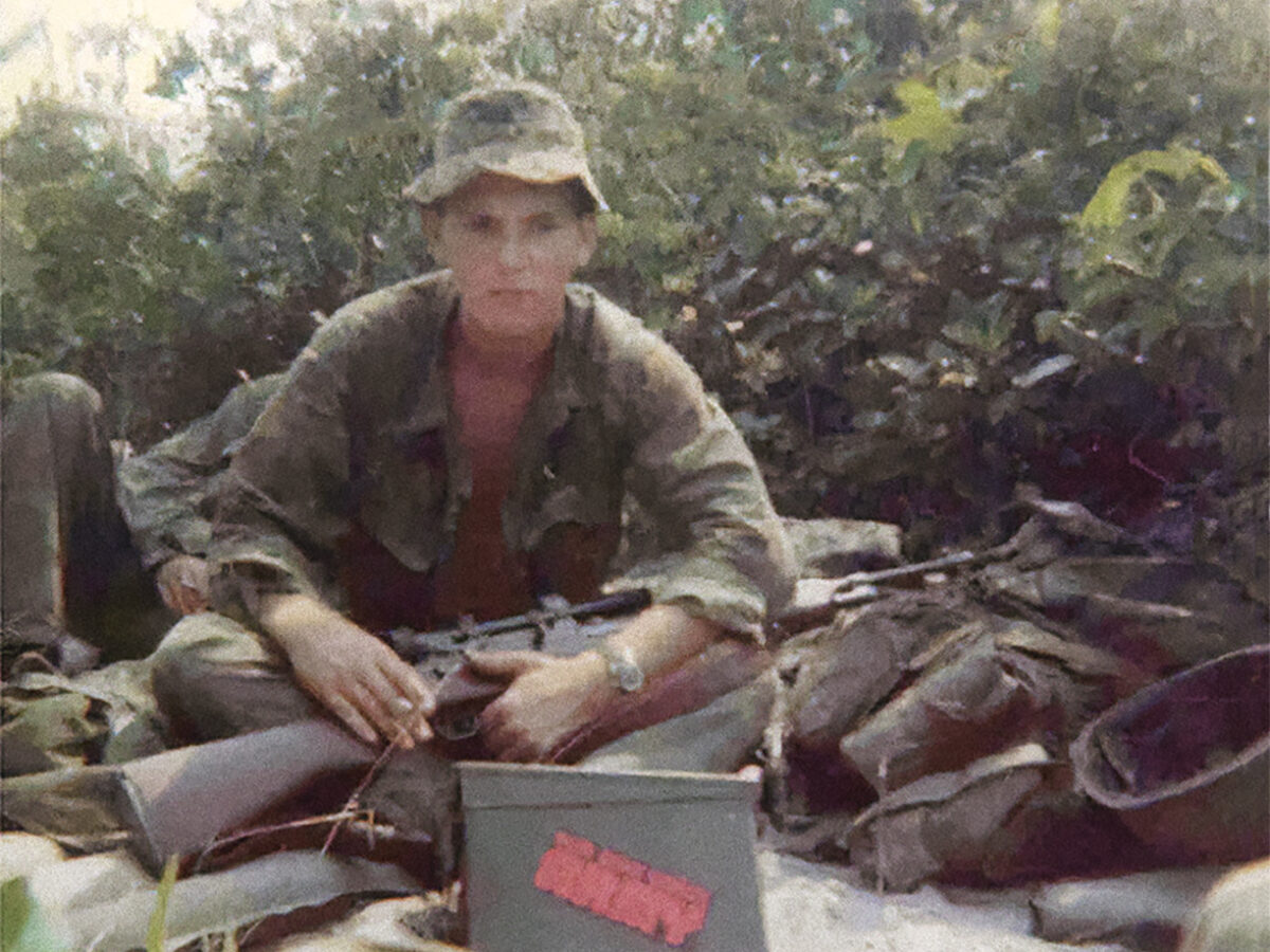 Photo of Adelbert F. Waldron III with rifle.
