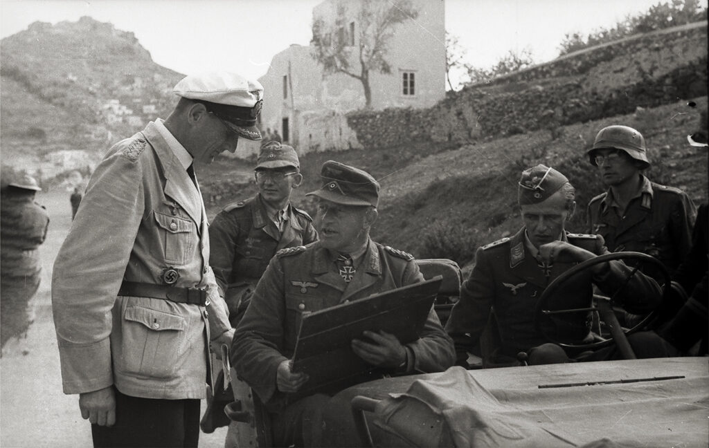 Photo of Müller with map on Leros.