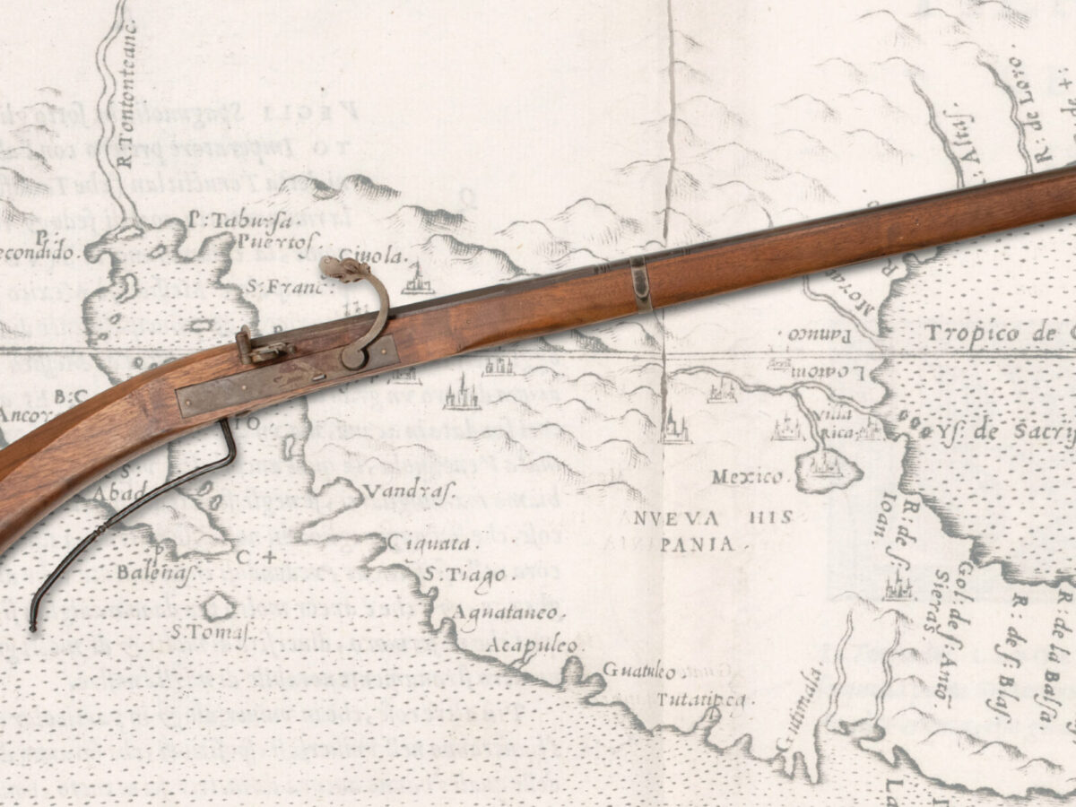 Spanish harquebus laid over map of North America