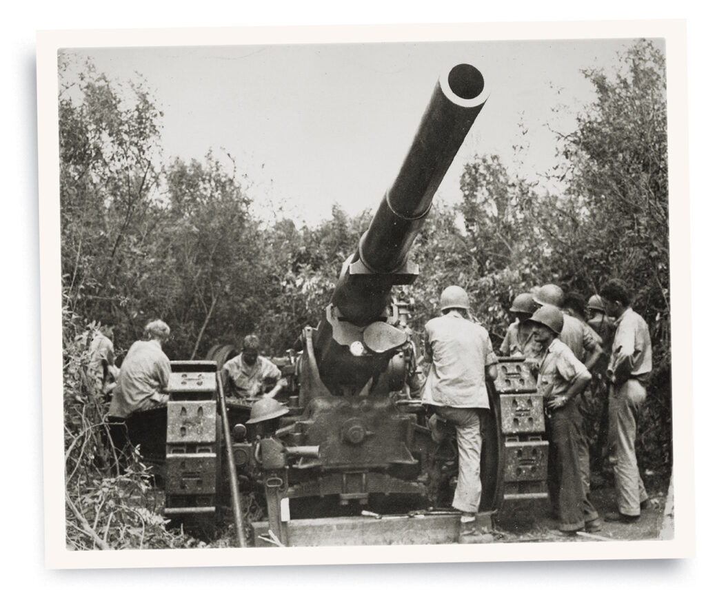 Photo of U.S. Marines manning a 155mm gun position on Guadalcanal during World War II.