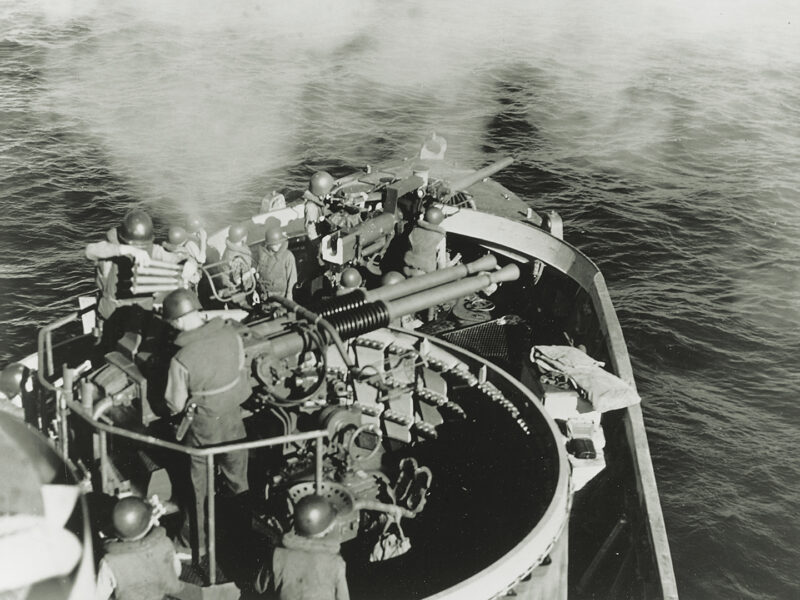 Photo of a LCS fairly bristled with guns, including the twin Bofors 40 mm L/60 antiaircraft guns and Mark 22 3-inch/50-caliber bow gun shown here in action off the Philippines in 1945.
