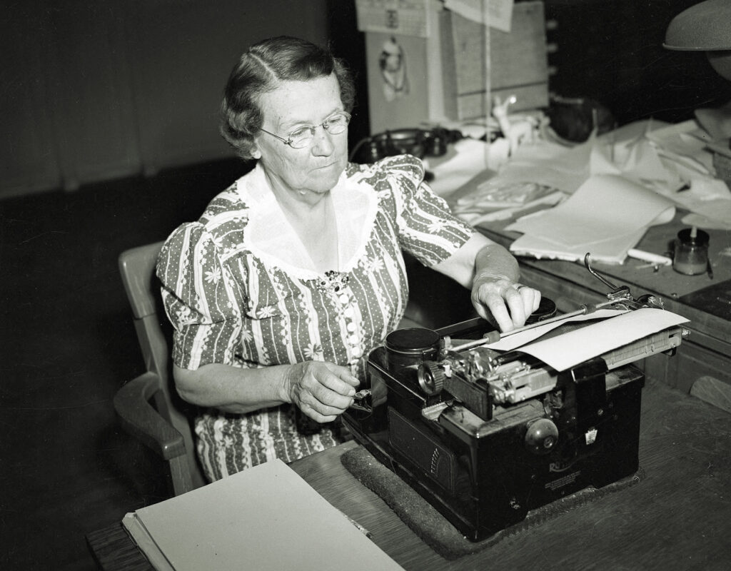 Olive Dixon at typewriter