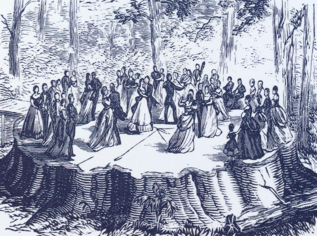 People dancing on giant sequoia stump