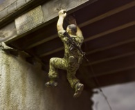 Ripley swung his body beneath the girders of the bridge. (U.S.N.A.)