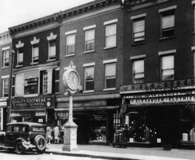 The clock at the scene of 12-year-old Capon's shoeshine days, later an underworld landmark. From 'Young Al Capone.' Click to enlarge.