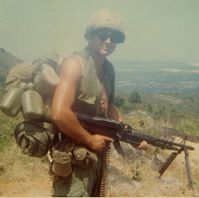 Loaded with gear, infantryman Leslie Sabo poses with his M-60. (Photo: James Bemus)