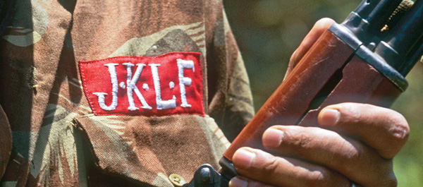 The fatigues and sleek Kalashnikovs of the guerrillas in the Jammu and Kashmir Liberation Front (JKLF) entranced young Kashmiri boys, serving almost as recruitment tools for the rebels. (&copy; Jacques Langevin/Sygma/Corbis) 